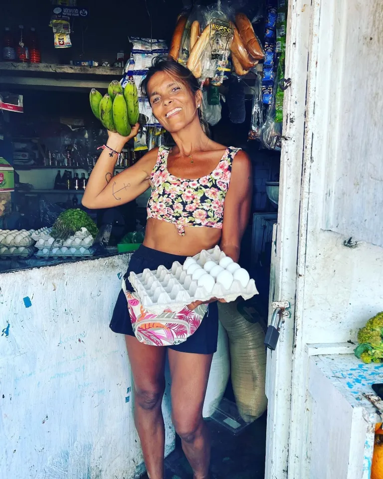 Samuela buying eggs and bananas at the local colmado